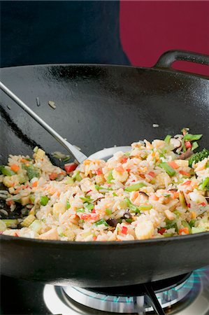 Frying vegetable rice in wok Stock Photo - Premium Royalty-Free, Code: 659-03526528