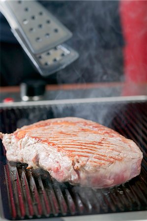 Grilling beef steak Stock Photo - Premium Royalty-Free, Code: 659-03526536