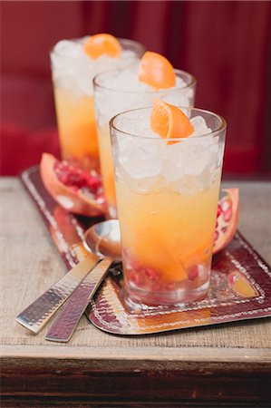 simsearch:659-06495307,k - Three fruity drinks with orange and pomegranate Stock Photo - Premium Royalty-Free, Code: 659-03527194