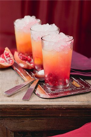 simsearch:659-06495307,k - Three fruity drinks with orange and pomegranate Stock Photo - Premium Royalty-Free, Code: 659-03527195