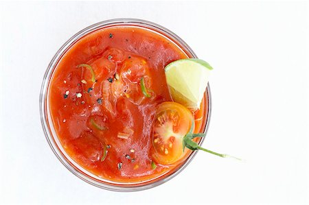 Tomato dip with wedge of lime Stock Photo - Premium Royalty-Free, Code: 659-03527472