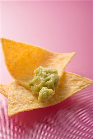 snack - Guacamole on tortilla chip Stock Photo - Premium Royalty-Free, Code: 659-03527702