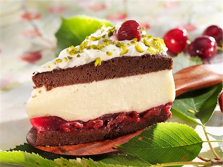simsearch:659-01848790,k - Piece of Black Forest gateau with chopped pistachios Stock Photo - Premium Royalty-Free, Code: 659-03528603