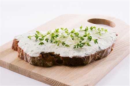spreading - Quark and bread with fresh cress on chopping board Stock Photo - Premium Royalty-Free, Code: 659-03528790
