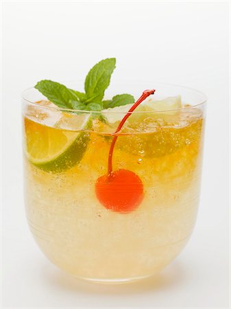 simsearch:659-01850296,k - Manhattan with lime and cocktail cherry Stock Photo - Premium Royalty-Free, Code: 659-03529094