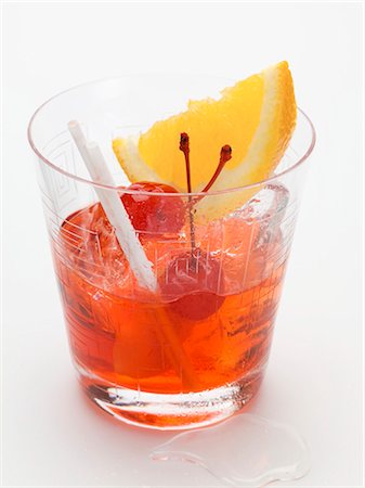 simsearch:659-01850296,k - Manhattan with cocktail cherries and orange wedge Stock Photo - Premium Royalty-Free, Code: 659-03529594