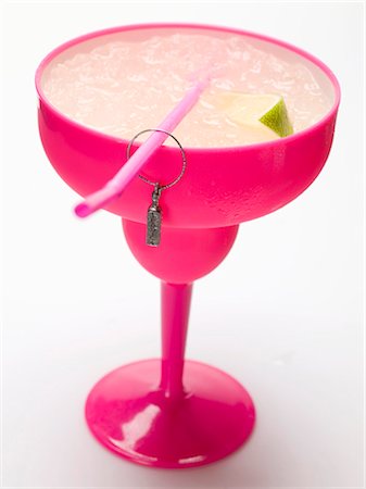 simsearch:659-01850296,k - Frozen Margarita with lime wedges in pink glass Stock Photo - Premium Royalty-Free, Code: 659-03529627