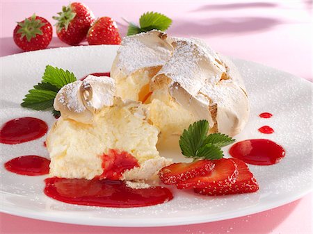 salzburg dumpling - Salzburger Nockerl (Austrian meringue dessert), strawberry sauce Stock Photo - Premium Royalty-Free, Code: 659-03529897
