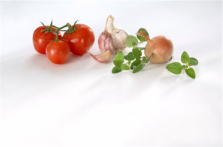 Tomatoes, garlic, onion and marjoram Stock Photo - Premium Royalty-Free, Code: 659-03529988