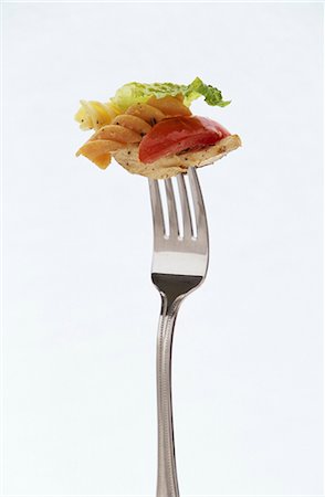fork with noodles - Pasta salad with chicken on fork Stock Photo - Premium Royalty-Free, Code: 659-03521040