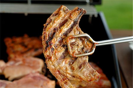 simsearch:659-06186142,k - Lamb chop in grill tongs Stock Photo - Premium Royalty-Free, Code: 659-03521967