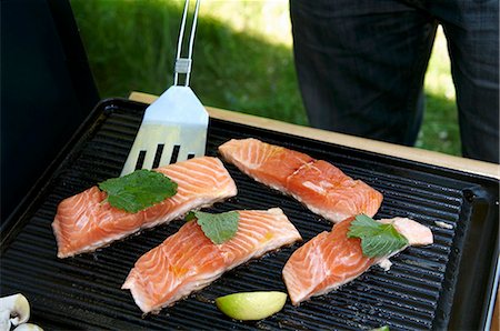 Salmon fillets on a grill Stock Photo - Premium Royalty-Free, Code: 659-03522264