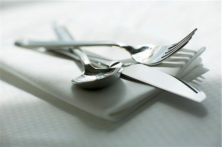 flatware - Knife, fork and spoon on napkin Stock Photo - Premium Royalty-Free, Code: 659-03522785