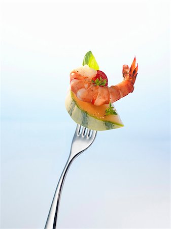 shellfish - A piece of melon and a cooked prawn on a fork Stock Photo - Premium Royalty-Free, Code: 659-03523110