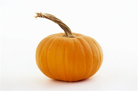 Small Pumpkin on a White Background Stock Photo - Premium Royalty-Free, Code: 659-03523222