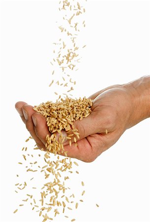 Someone pouring oats into their hand Stock Photo - Premium Royalty-Free, Code: 659-03523341