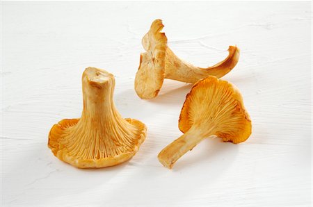 simsearch:659-03526248,k - Three chanterelles Stock Photo - Premium Royalty-Free, Code: 659-03523856