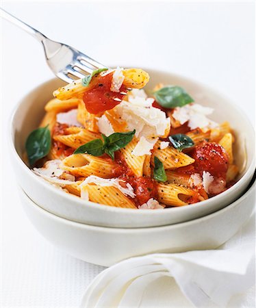 Penne with tomato sauce, Parmesan and basil Stock Photo - Premium Royalty-Free, Code: 659-03523994