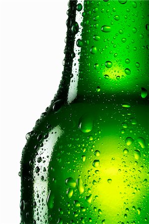 Green bottle of beer with drops of water (close-up) Stock Photo - Premium Royalty-Free, Code: 659-03534060