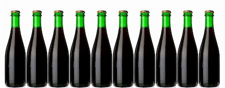 Ten green bottles standing in a row (stout, dark beer) Stock Photo - Premium Royalty-Free, Code: 659-03535695