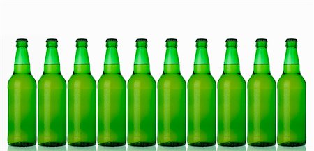 Ten green bottles standing in a row (lager) Stock Photo - Premium Royalty-Free, Code: 659-03535696