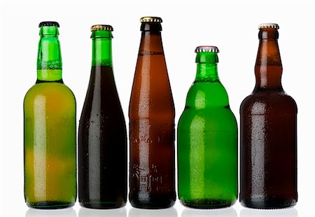 Various types of beer in bottles standing in a row Stock Photo - Premium Royalty-Free, Code: 659-03535699