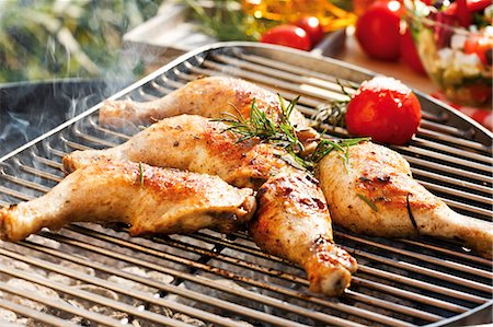 Barbecued chicken legs with rosemary and tomato Stock Photo - Premium Royalty-Free, Code: 659-03535959
