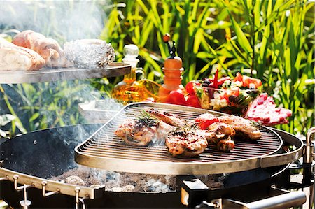 simsearch:659-01857024,k - Chicken legs on barbecue out of doors Stock Photo - Premium Royalty-Free, Code: 659-03535960