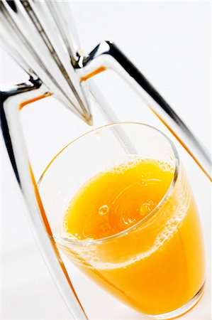 Orange juice with citrus squeezer Stock Photo - Premium Royalty-Free, Code: 659-03535987