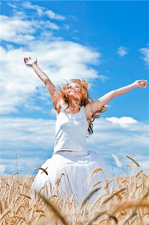 Young woman in barley field Stock Photo - Premium Royalty-Free, Code: 659-03536220