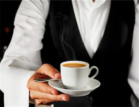 Waiter serving espresso Stock Photo - Premium Royalty-Free, Code: 659-03536366