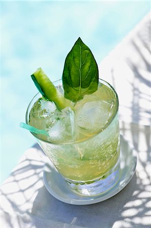 Glass of Ice Tea with Cucumber; Poolside Stock Photo - Premium Royalty-Free, Code: 659-03536585