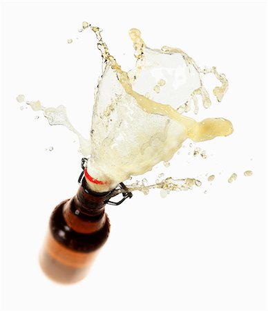 foam - Beer splashing out of brown bottle Stock Photo - Premium Royalty-Free, Code: 659-03536721