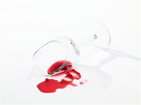 Broken wine glass with spilt red wine Stock Photo - Premium Royalty-Free, Code: 659-03536781