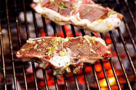 simsearch:659-06186142,k - Marinated lamb chops on barbecue rack Stock Photo - Premium Royalty-Free, Code: 659-03537206