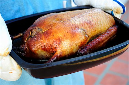 simsearch:659-01857024,k - Stuffed roast goose in a roasting dish Stock Photo - Premium Royalty-Free, Code: 659-03537732