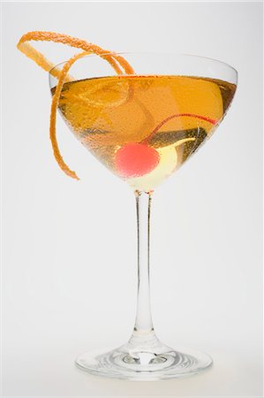 simsearch:659-01850296,k - Manhattan with cocktail cherry and orange zest Stock Photo - Premium Royalty-Free, Code: 659-03530406