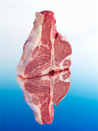 Raw Porterhouse steak with reflection Stock Photo - Premium Royalty-Free, Code: 659-03531295