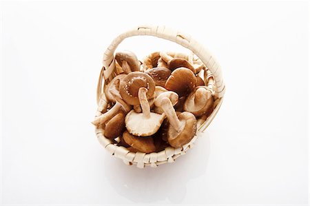 simsearch:659-03526248,k - Fresh shiitake mushrooms in basket Stock Photo - Premium Royalty-Free, Code: 659-03531492
