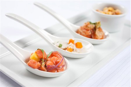 Three Spoons of Assorted Seafood Appetizers Stock Photo - Premium Royalty-Free, Code: 659-03531778