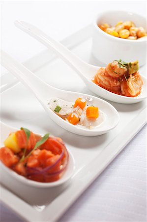 Three Spoonfuls of Seafood Appetizers Stock Photo - Premium Royalty-Free, Code: 659-03531781