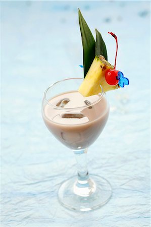 simsearch:659-01850296,k - Drink made with rum, cassis syrup, pineapple juice & coconut milk Stock Photo - Premium Royalty-Free, Code: 659-03531864
