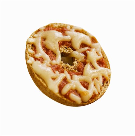 Mini Bagel Pizza on White Background Stock Photo - Premium Royalty-Free, Code: 659-03532472