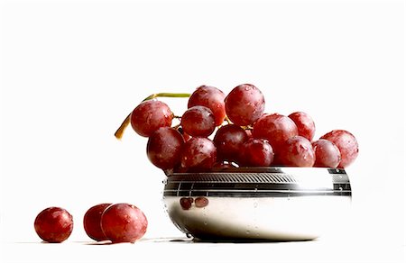 red grape - Fresh red grapes in and beside silver bowl Stock Photo - Premium Royalty-Free, Code: 659-03532899