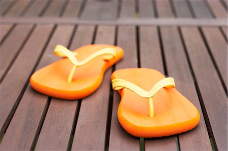 flips flops - Flip-flops on decking Stock Photo - Premium Royalty-Free, Code: 659-03533443