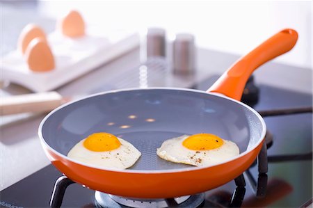 egg dish - Two fried eggs in a frying pan Stock Photo - Premium Royalty-Free, Code: 659-03533744