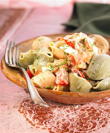 simsearch:652-05807406,k - Lumaconi rigate with smoked salmon,tomatoes and dill Stock Photo - Premium Royalty-Free, Code: 652-05806931