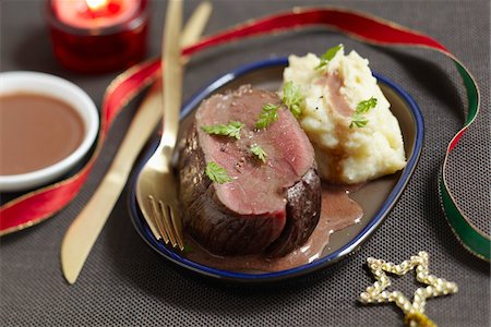 simsearch:652-05807406,k - Roast bison with Grand veneur sauce,mixed mashed potatoes and celeriac Stock Photo - Premium Royalty-Free, Code: 652-05808479