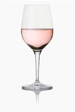 simsearch:652-03802277,k - Stemmed glass of rosé wine Stock Photo - Premium Royalty-Free, Code: 652-06818721
