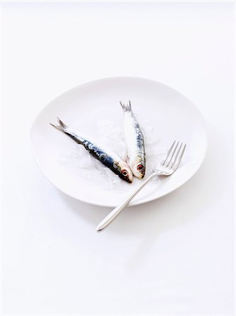 fish food design - Two anchovies on a plate Stock Photo - Premium Royalty-Free, Code: 652-06819302